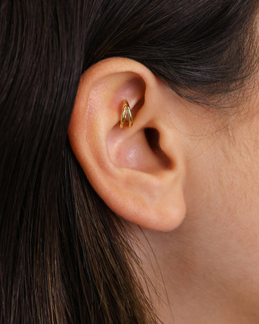 Solid double clicker hoop earrings in 18k gold and sterling silver as rook earrings. 